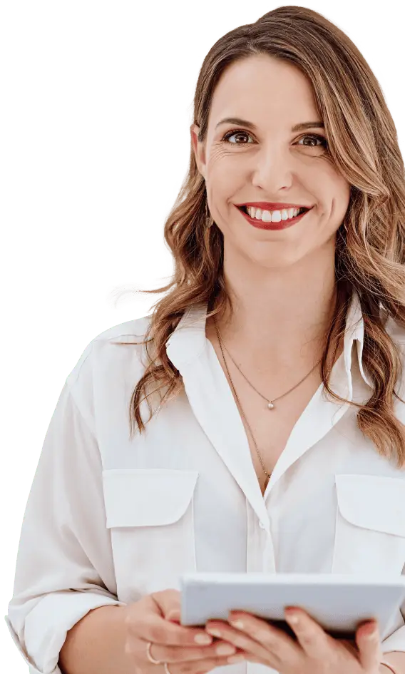 Dental practice team member smiling while holding a tablet