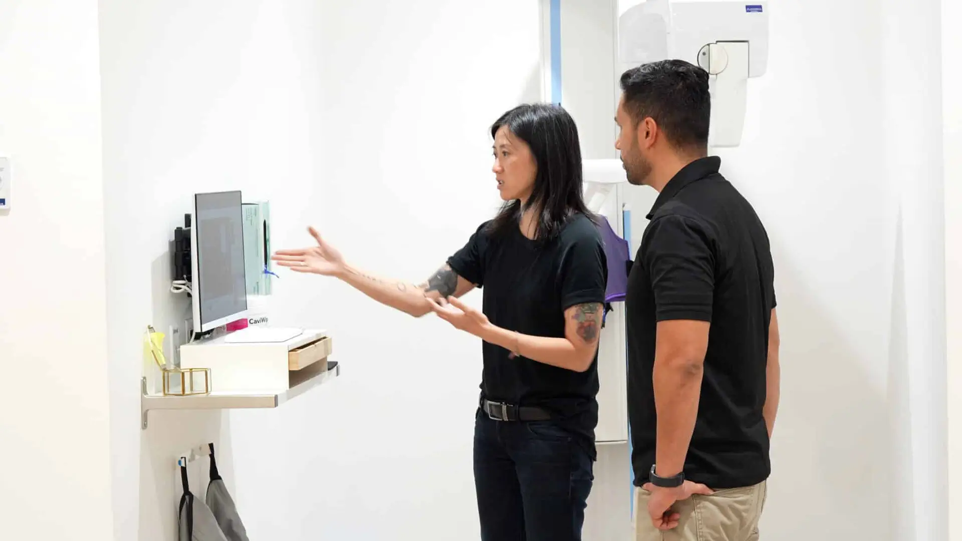 Dr. Alice Hoang smiling during an onsite visit with William Kohl of F1 iT