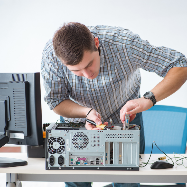 onsite dental technician fixing computer