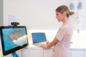 Technician using modern technology in a clinic