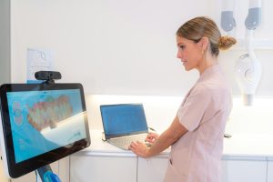 Technician Using Modern Technology In A Clinic